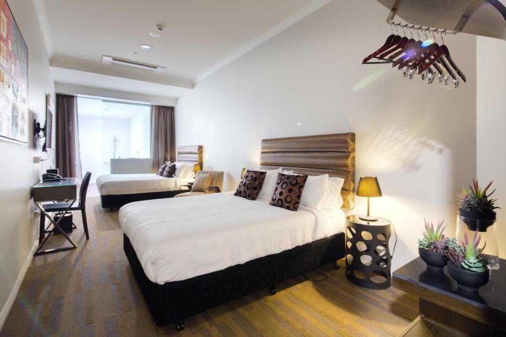 Postel nebo postele na pokoji v ubytování 57Hotel