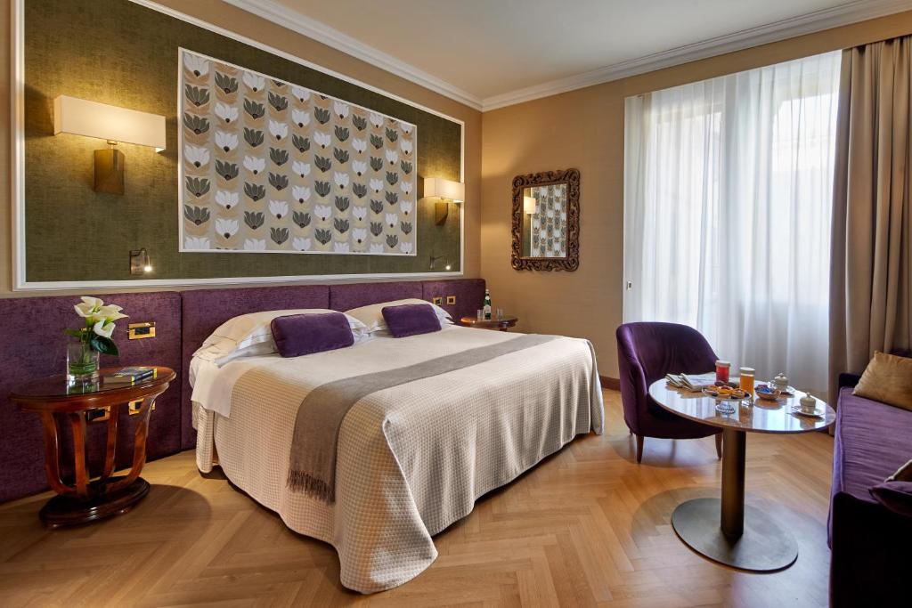 Postel nebo postele na pokoji v ubytování Hotel Accademia