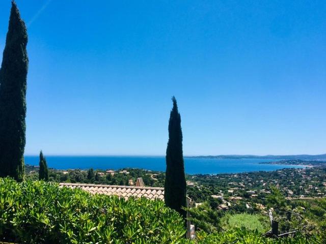 a view of the ocean from a hill with trees at les Issambres baie Saint Tropez appt standing 4 P in Les Issambres