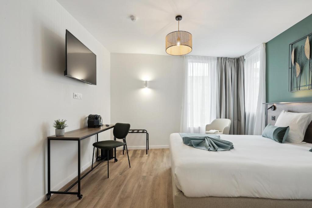 Posteľ alebo postele v izbe v ubytovaní All Suites Noisy Le Grand