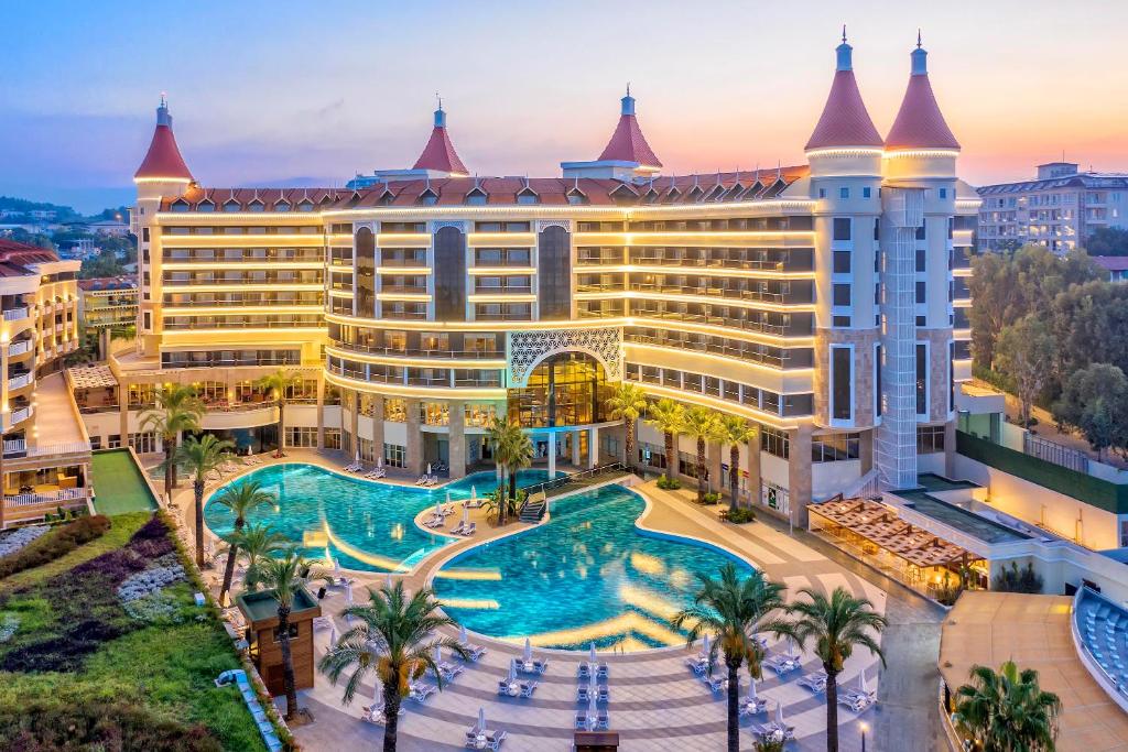 an aerial view of a hotel with a swimming pool at Kirman Leodikya Resort in Okurcalar