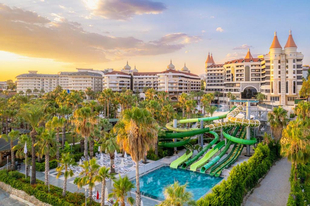 a water park at a resort with a roller coaster at Kirman Arycanda De Luxe in Okurcalar