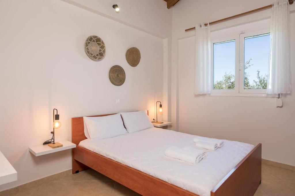 Posteľ alebo postele v izbe v ubytovaní Villa Cleronomia, private pool, seaview,