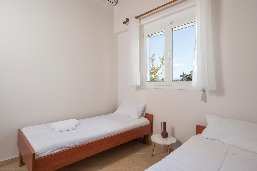 Posteľ alebo postele v izbe v ubytovaní Villa Cleronomia, private pool, seaview,