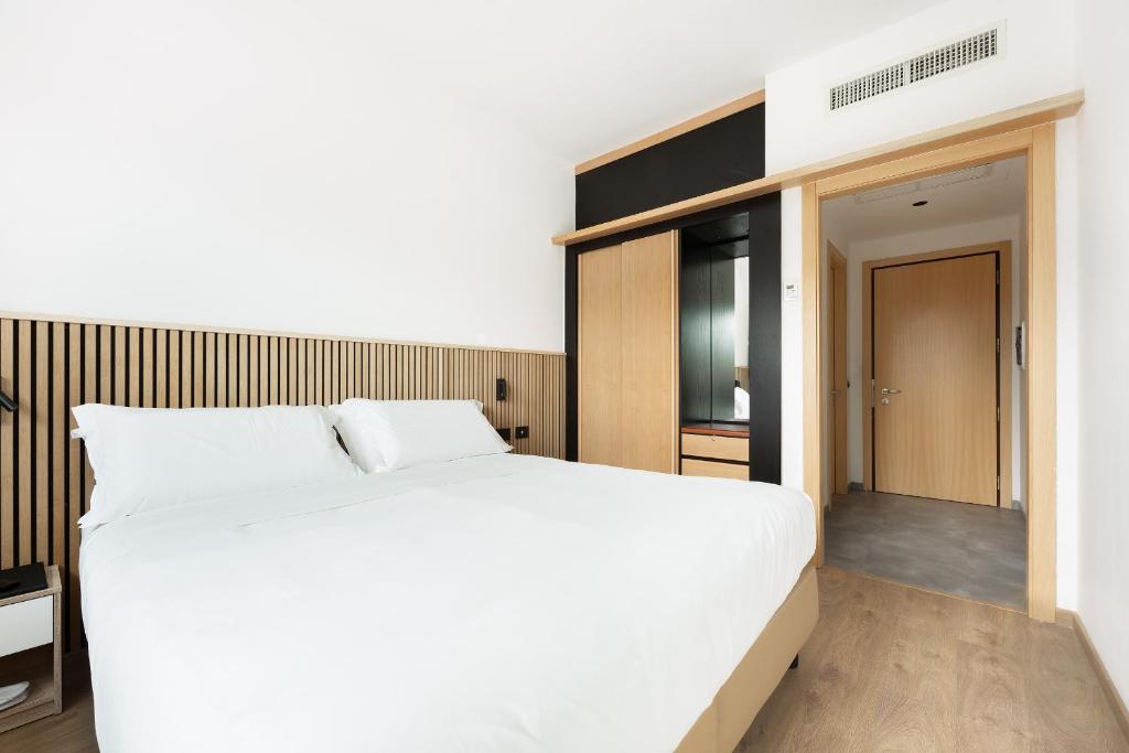 Postel nebo postele na pokoji v ubytování Moon Palace Hotel