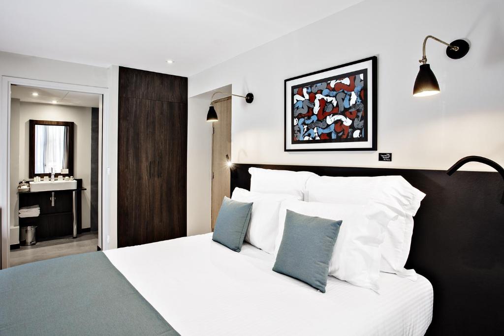 Postel nebo postele na pokoji v ubytování Boutique Hotel Villa du Taur