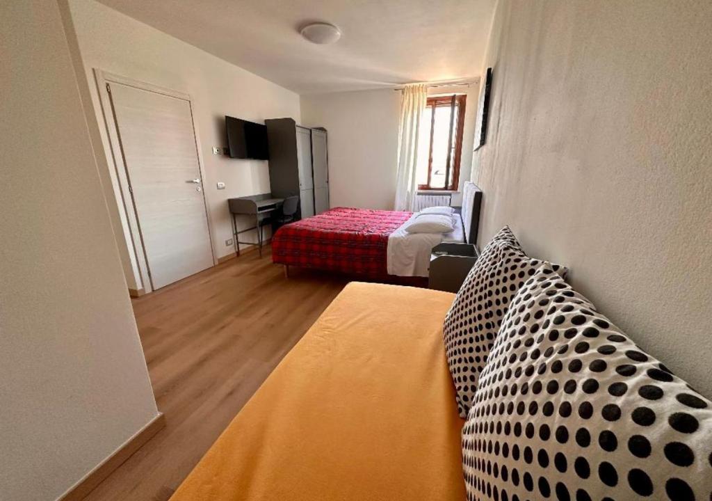 Postel nebo postele na pokoji v ubytování Sulla Ciclabile Apartment lungo il fiume Adige