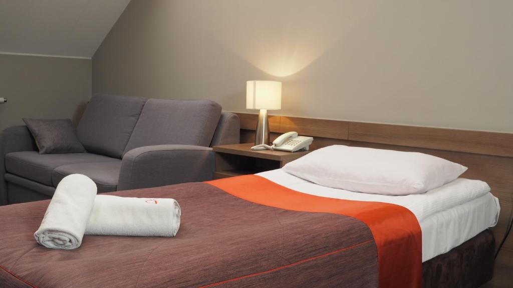 Łóżko lub łóżka w pokoju w obiekcie Hotel Konstancja