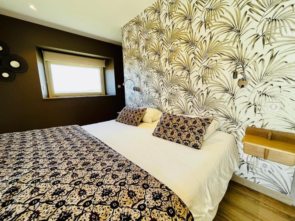 Postel nebo postele na pokoji v ubytování Hôtel Le Troubadour à Rocamadour