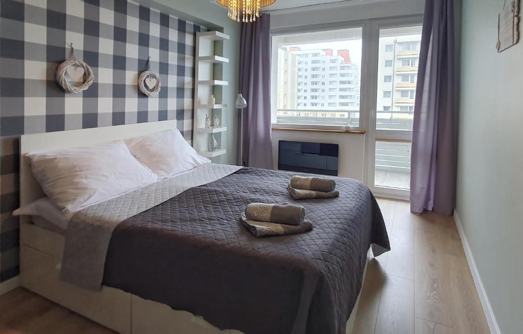 Posteľ alebo postele v izbe v ubytovaní Holiday Home SLAVIA NEW 408 z sypialnią i balkonem przy plaży