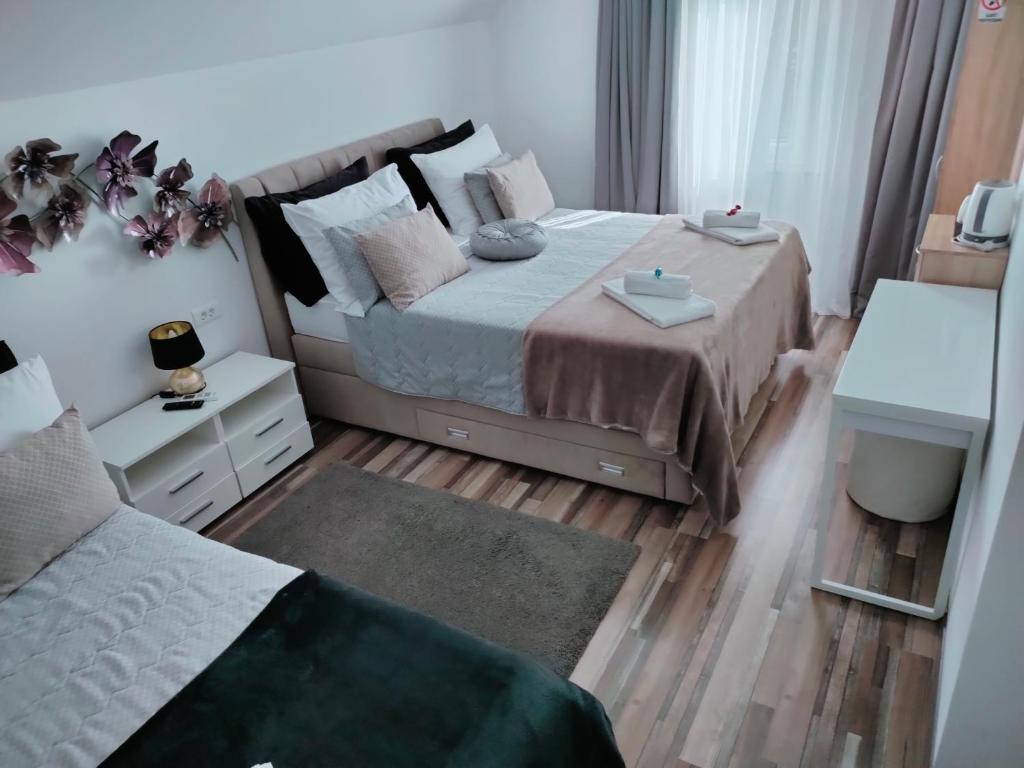 Postel nebo postele na pokoji v ubytování Vila Lemic Postojna