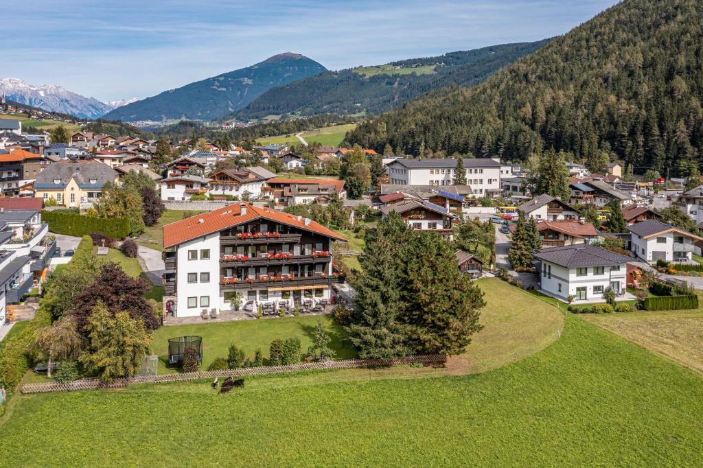 an aerial view of a town in a mountain village at Hotel Eschenhof & Apartments in Fulpmes