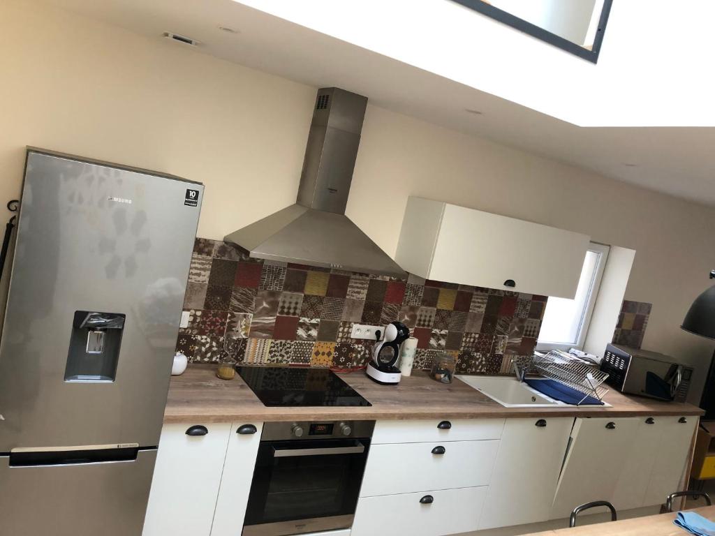 Kuchyňa alebo kuchynka v ubytovaní Une maison agréable pour se détendre
