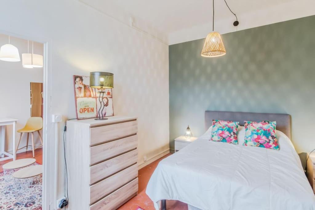 Posteľ alebo postele v izbe v ubytovaní SERENITE - Appartement climatisé au calme - WIFI