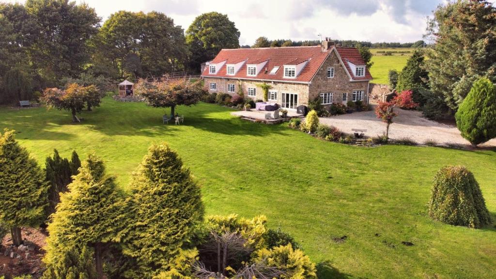 an aerial view of a large house with a yard at Ticketyboo Suites in Pickering