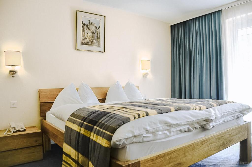 Postel nebo postele na pokoji v ubytování Hotel Regina Terme