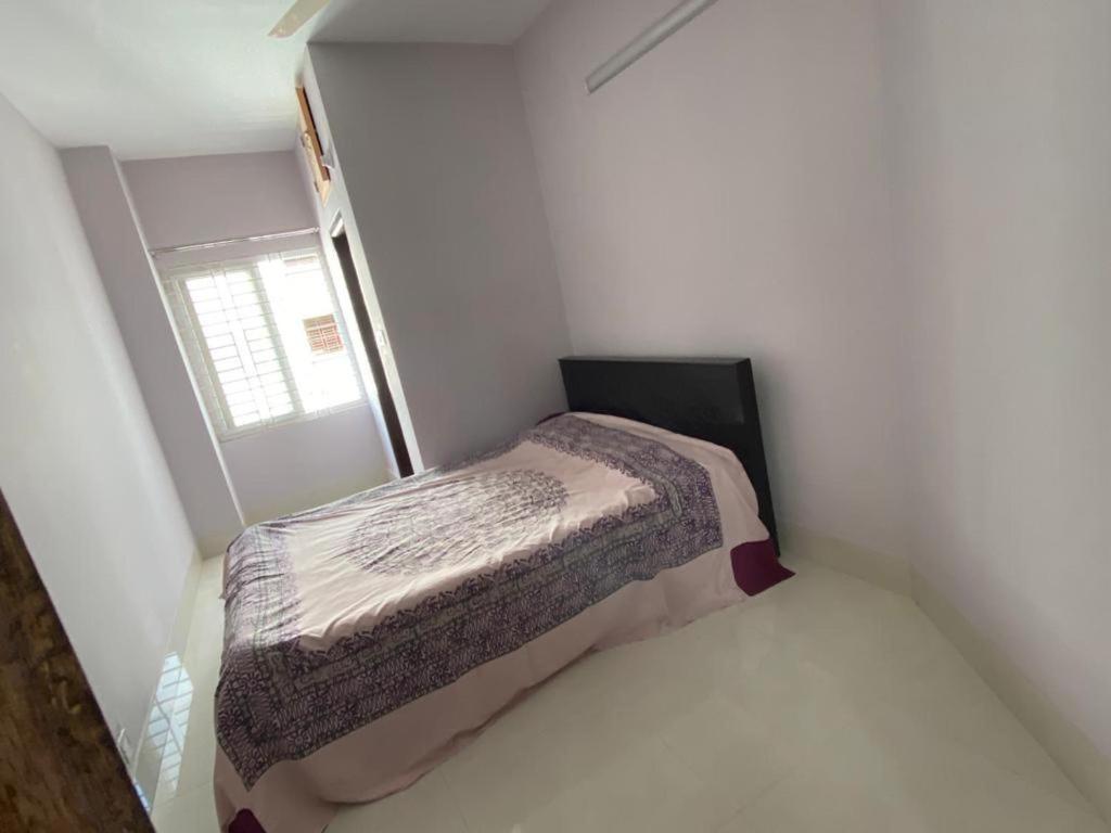 Ένα ή περισσότερα κρεβάτια σε δωμάτιο στο 4 Beds Condo Holiday Home at Bashundhara Dhaka