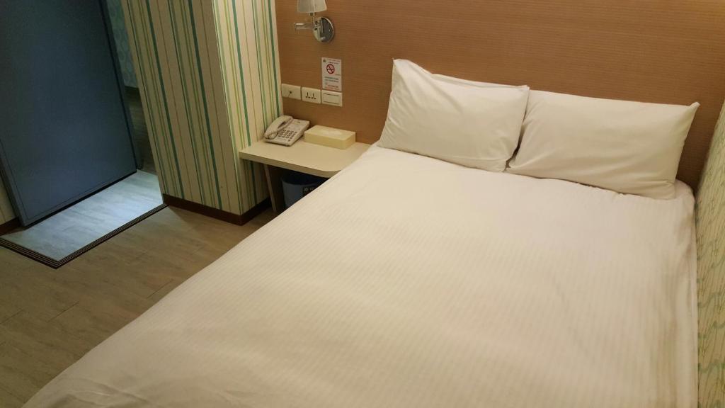 Postel nebo postele na pokoji v ubytování Honey Prince