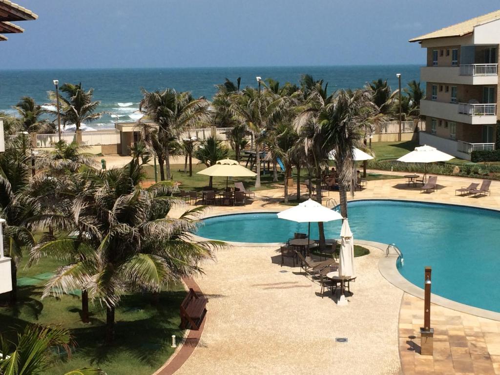 Vista de la piscina de Ap Paraiso das Dunas - Pé na areia o alrededores