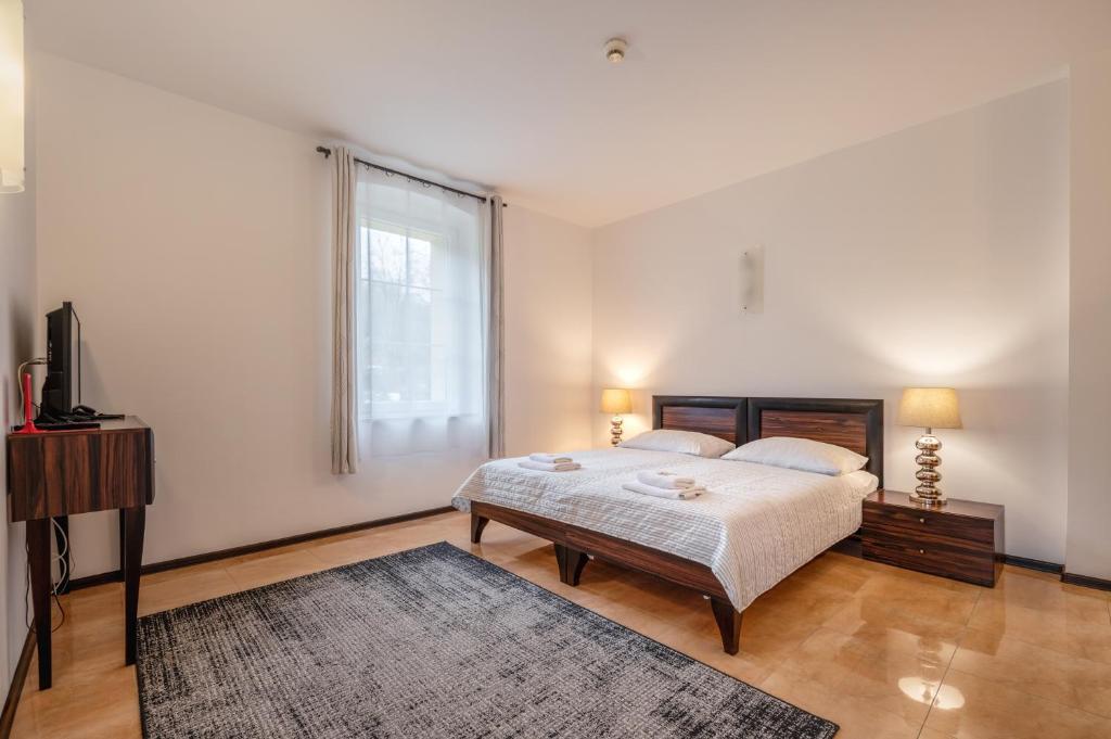 Posteľ alebo postele v izbe v ubytovaní Villa Tilia