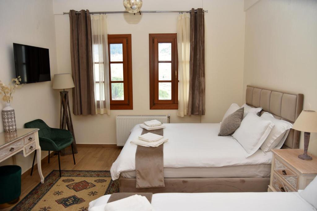 Postel nebo postele na pokoji v ubytování NUCA GUESTHOUSE