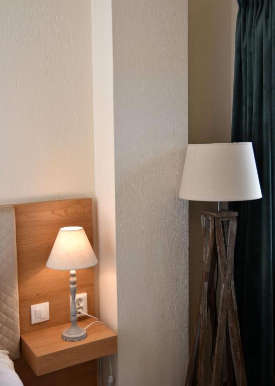 Postel nebo postele na pokoji v ubytování NUCA GUESTHOUSE