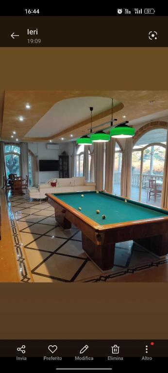a room with a pool table in a house at La villa di Lucio in Marino
