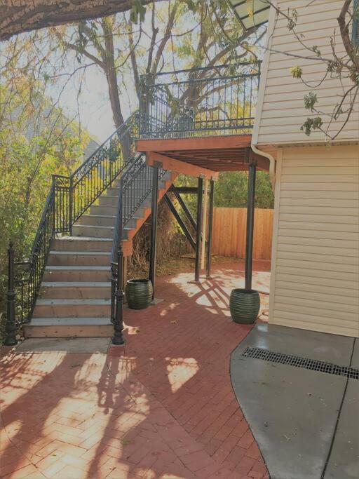 a staircase leading up to a house with a deck at Aunt Beans Guest Suite in Kanab