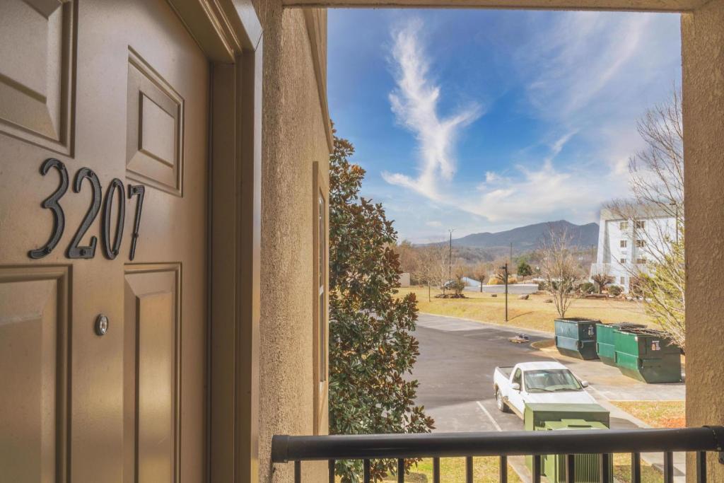 a view from a balcony of a car parked in a parking lot at MVC - Unit 3207 - Happy Place in Pigeon Forge