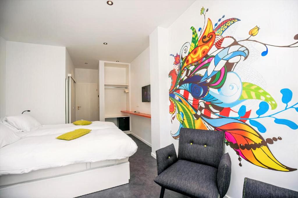 Postel nebo postele na pokoji v ubytování Hotel L'Esprit Sain