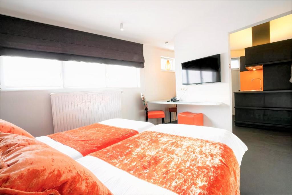 Postel nebo postele na pokoji v ubytování Hotel L'Esprit Sain