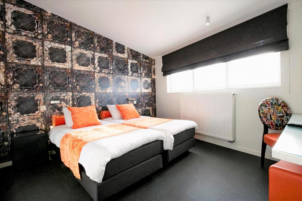 Postel nebo postele na pokoji v ubytování Hotel L'Esprit Sain