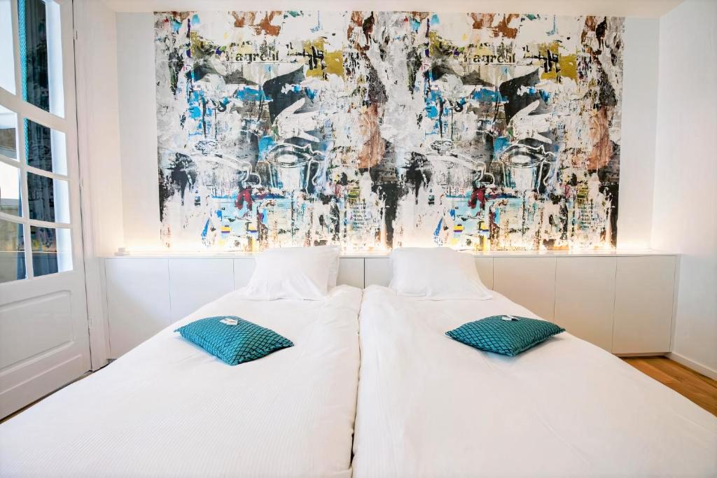 Postel nebo postele na pokoji v ubytování Hotel L'Esprit Sain
