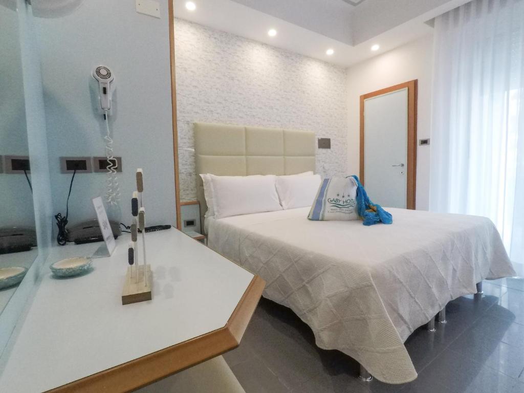 Postel nebo postele na pokoji v ubytování Hotel Gaby