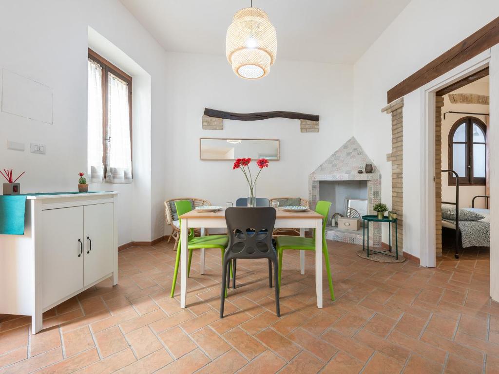 a kitchen and dining room with a table and chairs at Santa Margherita House in Cagliari
