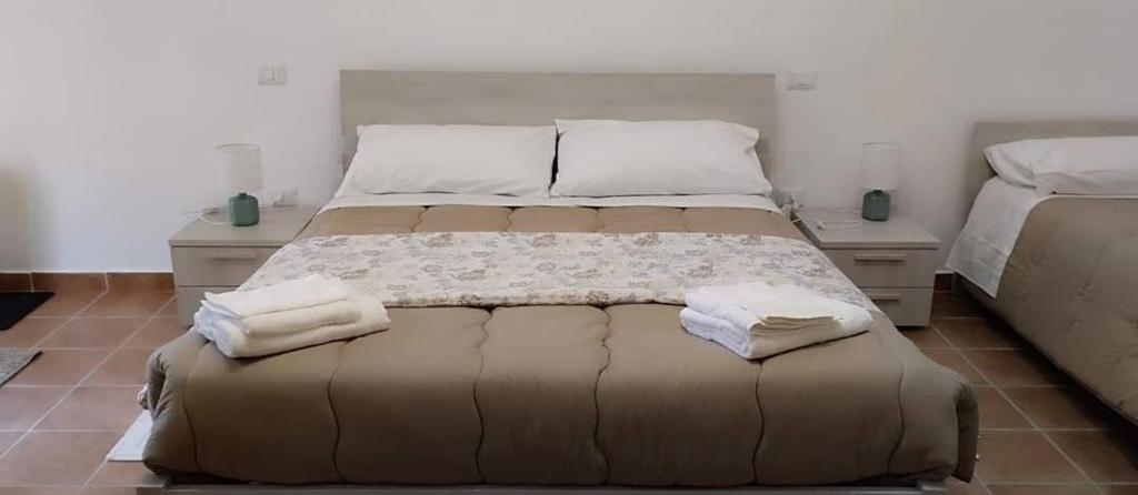 En eller flere senge i et værelse på La Casa di Amelia