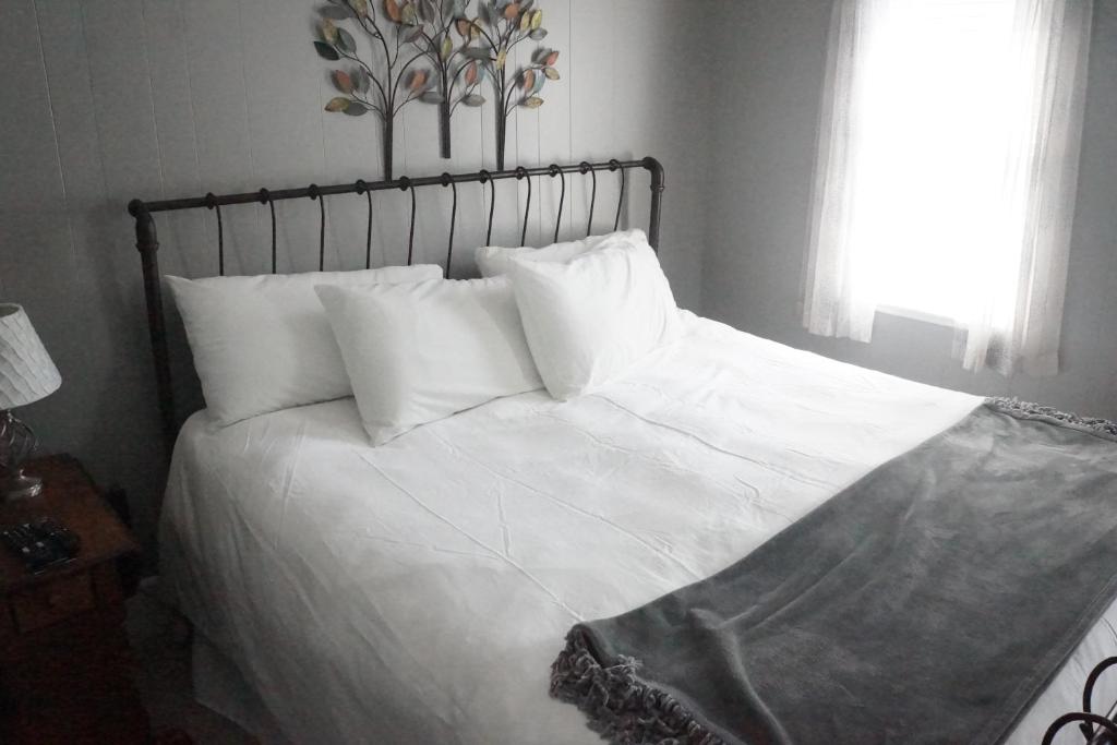 Voodi või voodid majutusasutuse The Frogtown Inn toas