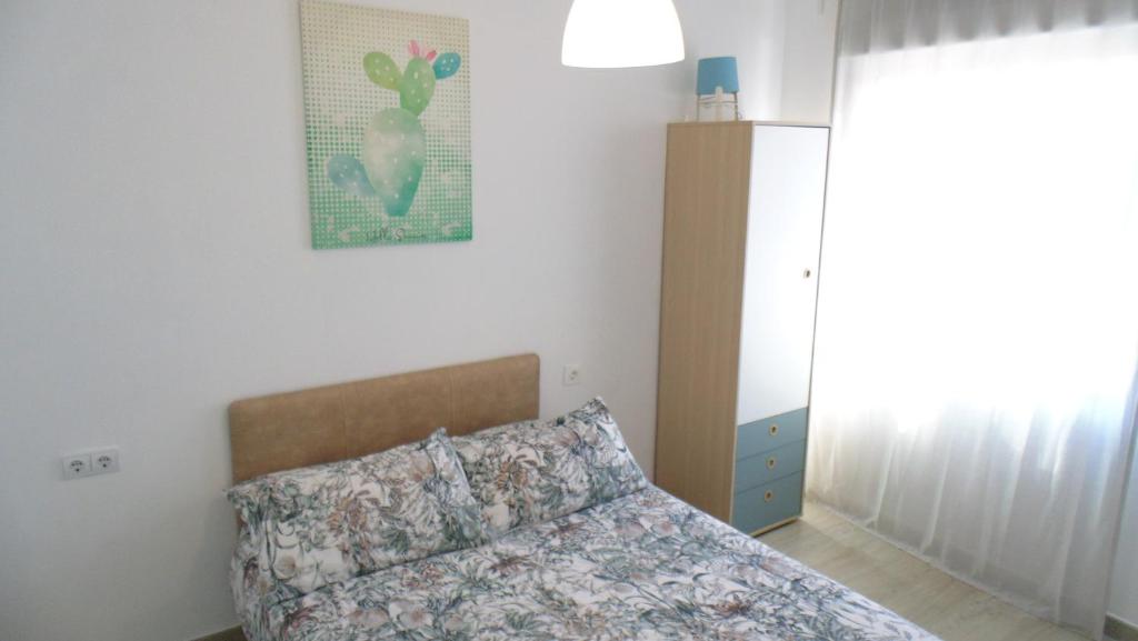 Posteľ alebo postele v izbe v ubytovaní APARTAMENTO EN CENTRO A 150M DEL MAR Apolo B