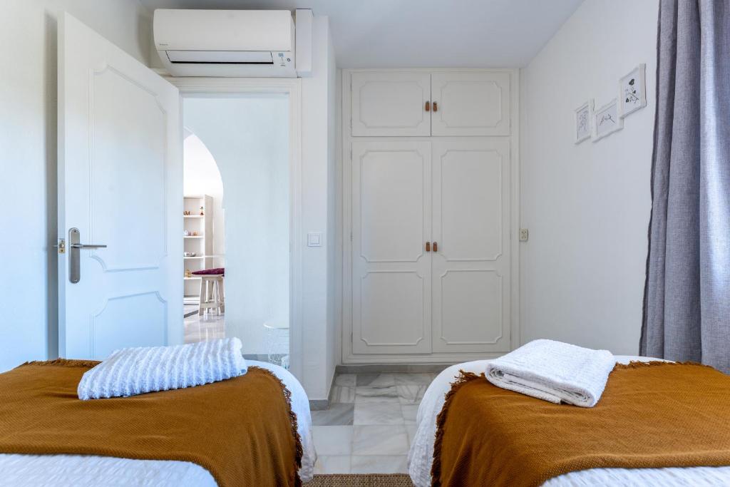 Posteľ alebo postele v izbe v ubytovaní Oasis la Cala