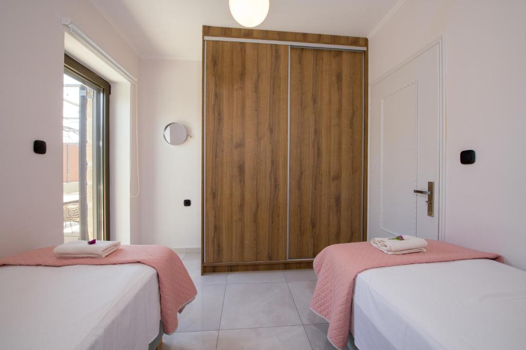 Posteľ alebo postele v izbe v ubytovaní Anastasia & Maria Luxury Residence