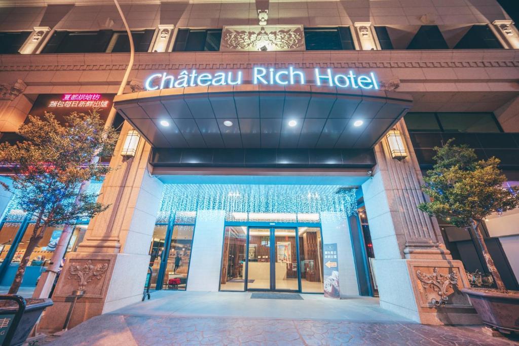 a building with a sign that reads chicago rich hotel at Chateau-Rich Hotel in Tainan
