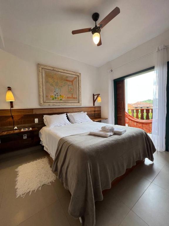 Postel nebo postele na pokoji v ubytování Cama e Café Tiradentes