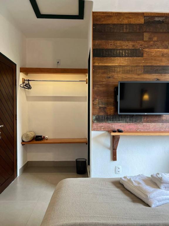 TV a/nebo společenská místnost v ubytování Cama e Café Tiradentes