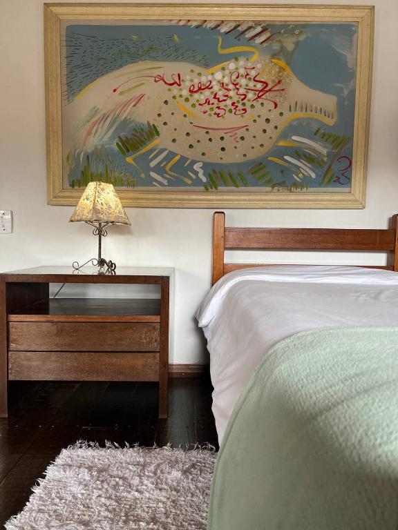 Postel nebo postele na pokoji v ubytování Cama e Café Tiradentes
