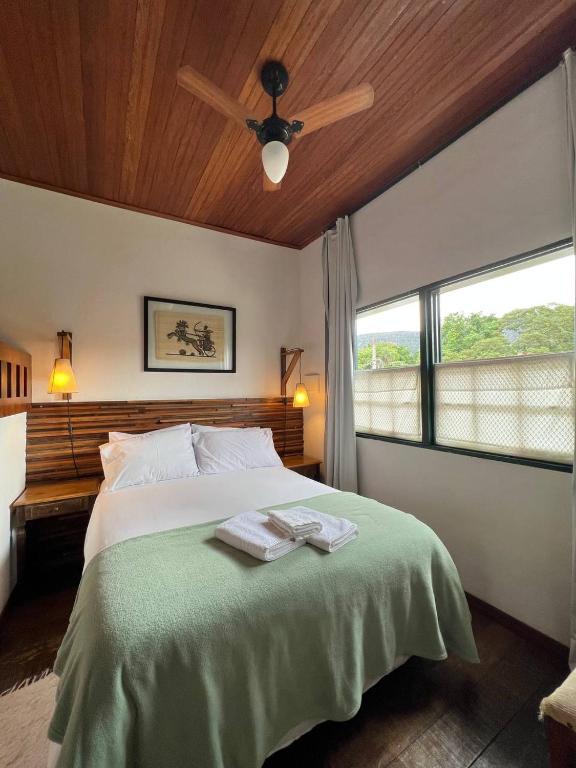 Postel nebo postele na pokoji v ubytování Cama e Café Tiradentes