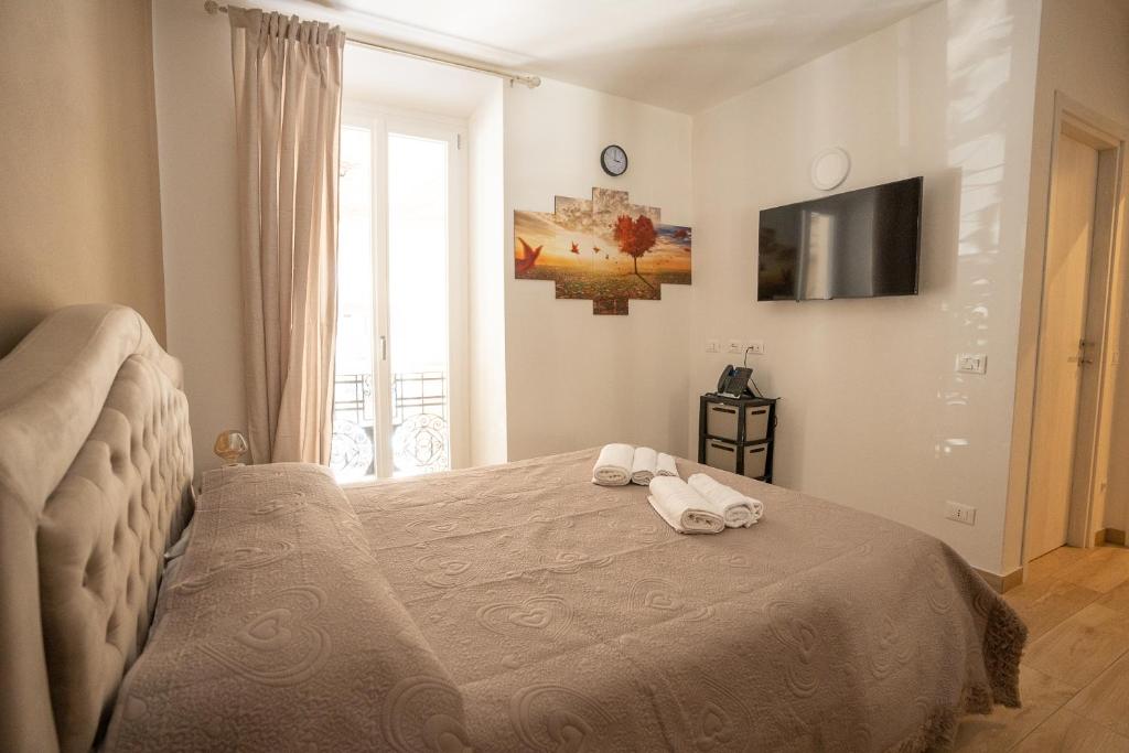 Postel nebo postele na pokoji v ubytování Le Stelle Della Spezia
