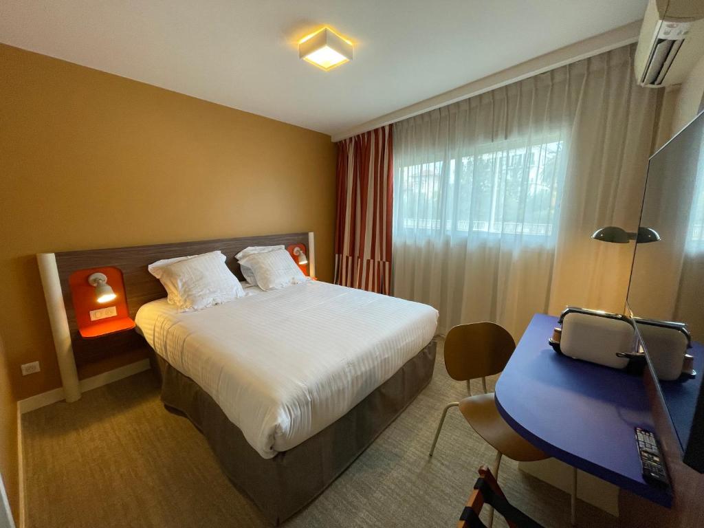 Postel nebo postele na pokoji v ubytování Hotel Abrial