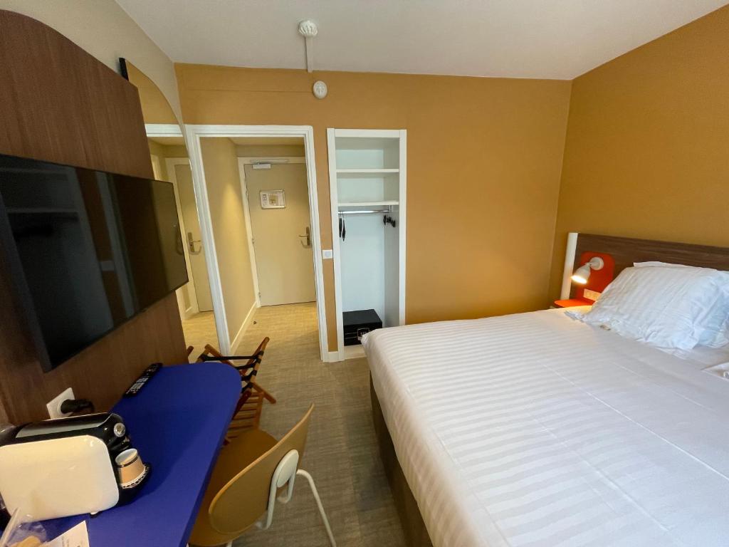 Postel nebo postele na pokoji v ubytování Hotel Abrial