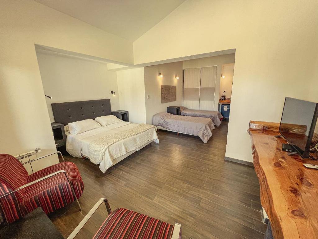 Ένα ή περισσότερα κρεβάτια σε δωμάτιο στο Estancia Alto San Pedro