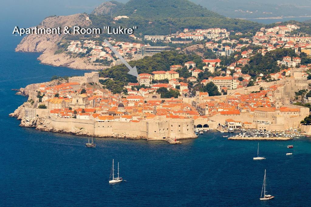 an aerial view of a city with boats in the water at Apartment& Room Lukre / Apartment Lukre with terrace in Dubrovnik